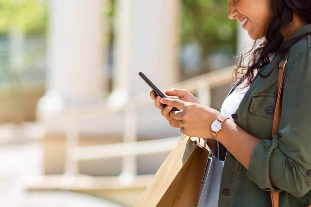 A woman using her smartphone to shop online